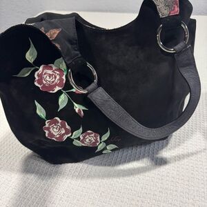 Jen Aprile Black Suede Boho Bag with flower design inside of bag